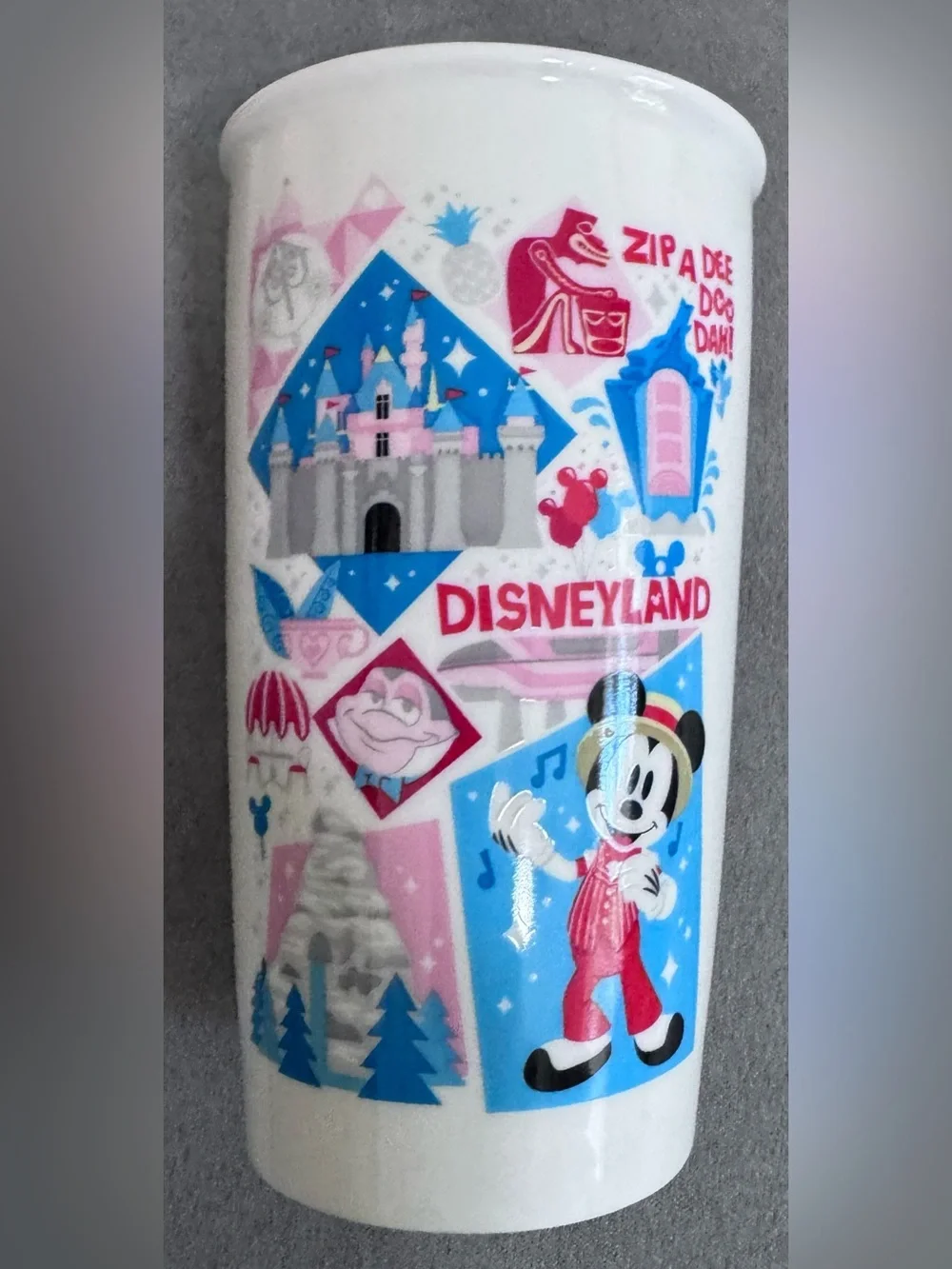 Starbucks Disneyland Travel Mug with Blue Lid and Pink/Blue Graphics